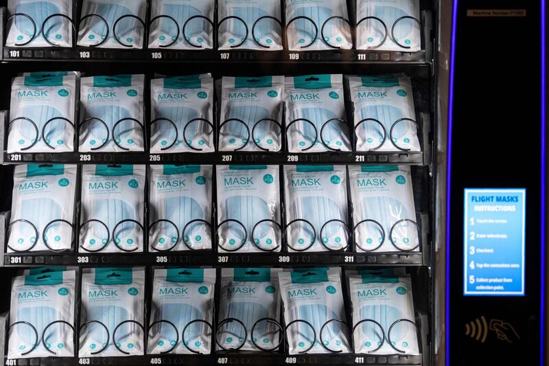 Disposable face masks are displayed for sale in Terminal 1 of Manchester Airport. AFP