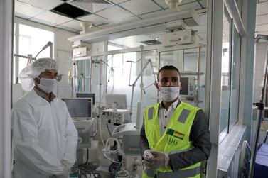 FILE PHOTO: A nurse and a trainer are pictured during a training for operating ventilators, recently provided by the World Health Organization, for the intensive care ward of a hospital allocated for coronavirus patients in preparation for any possible spread of the coronavirus disease (COVID-19), in Sanaa, Yemen April 8, 2020. Picture taken April 8, 2020. REUTERS/Khaled Abdullah/File Photo