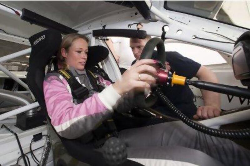 Pauline Zwart checks the car before training runs at the Dubai Autodrome yesterday. The Racing Divas team will compete at the 24 Hours of Dubai this weekend.