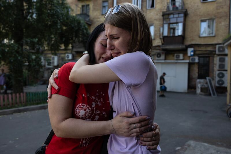 Ukrainian women cry as they survey the damage caused by a Russian missile strike on the northern city of Chernihiv, about 50km from the border with Belarus.