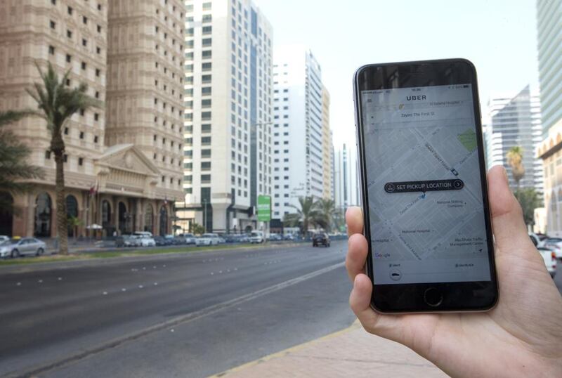 Above, an Uber application installed on a smartphone. Uber and Careem interrupted their services starting Saturday afternoon. Christopher Pike / The National