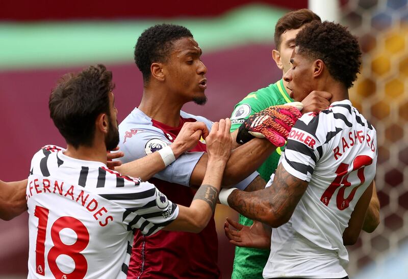 Villa's Ezri Konsa clashes with Marcus Rashford of United. EPA