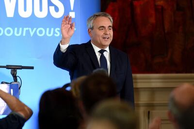 Xavier Bertrand, former minister and candidate to his succession as president of the northern France Hauts-de-France region, waves after a speech following the first results in the second round of the French regional elections in Saint-Quentin, on June 27, 2021. Early results shows Xavier Bertrand, largely winning the second round of regional elections in the Hauts-de-France, ahead of the RN candidate and the head of the list of the union of the left.  / AFP / FRANCOIS LO PRESTI
