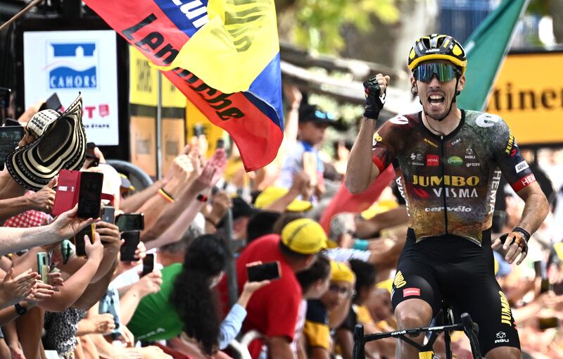 Jumbo-Visma team's French rider Christophe Laporte celebrates as he wins the 19th stage of the Tour de France. AFP