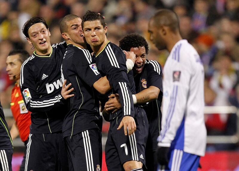 ZARAGOZA, SPAIN - DECEMBER 12:  Cristiano Ronaldo (C) of Real Madrid celebrates with his team mates Pepe, Mezut Ozil (L) and Marcelo VIeira (R) after scoring Real's second goal during the La Liga match between Real Zaragoza and Real Madrid at La Romareda stadium on December 12, 2010 in Zaragoza, Spain.  (Photo by Angel Martinez/Getty Images)