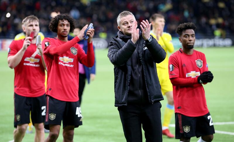 Manchester United manager Ole Gunnar Solskjaer and players applaud fans after the match against Astana. Reuters