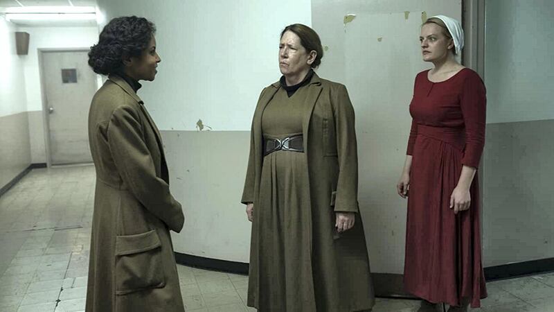 Elisabeth Moss, Ann Dowd, and Ipsita Paul in The Handmaid's Tale (2017) IDMb