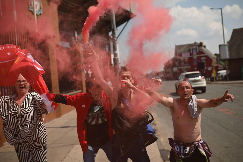 Liverpool fans celebrate outside Anfield on Friday, the second day of partying. AFP