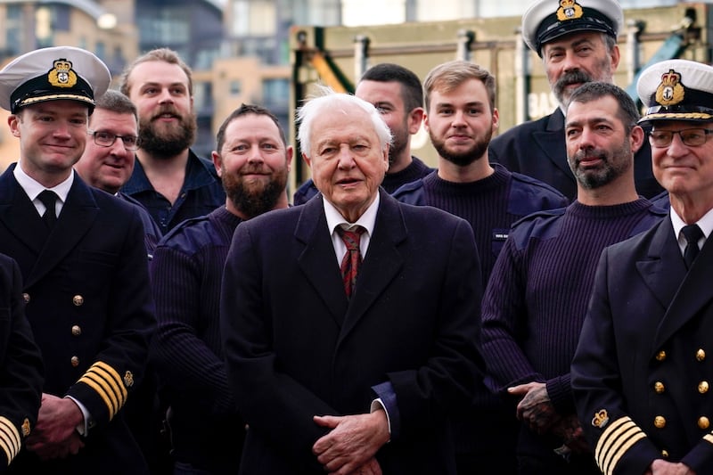 Sir David with the crew of the RSS Sir David Attenborough in London. AP Photo