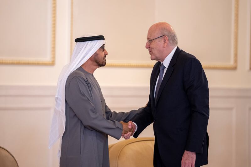 Najib Mikati, Prime Minister of Lebanon, speaks with Sheikh Mohamed at the Presidential Airport in Abu Dhabi. Abdulla Al Junaibi for the Ministry of Presidential Affairs