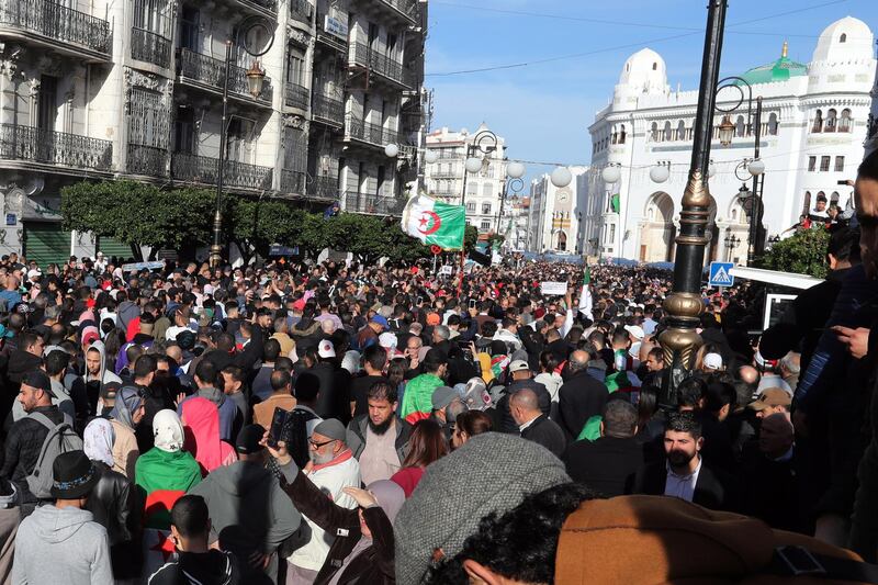 epa08062869 Algerians chant slogans as they march to protest a day ahead of the presidential elections, in Algeria, Algeria, 11 December 2019. Protesters are opposing presidential elections, scheduled for 12 December, as they see the five candidates running to replace Abdelaziz Bouteflika linked to the former regime.  EPA/MOHAMED MESSARA