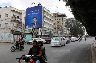 A poster featuring Lebanese Information Minister George Kordahi in Sanaa on October 31. Reuters