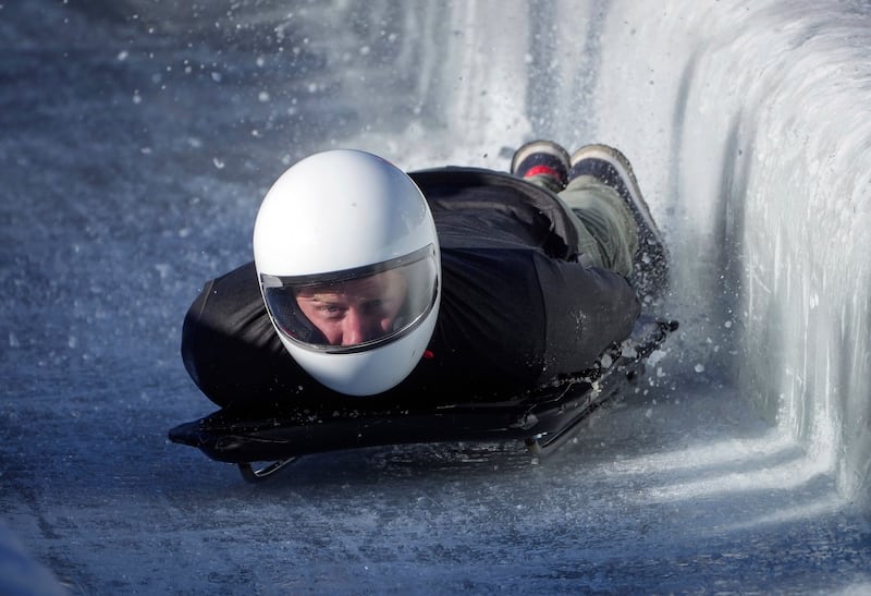 Prince Harry, the Duke of Sussex, hits the wall as he slides down the track on a skeleton sled during an Invictus Games training camp, in Whistler, British Columbia, Thursday, Feb.  15, 2024.  Invictus Games Vancouver Whistler 2025 is scheduled to take place from Feb.  8-16, 2025.  (Darryl Dyck / The Canadian Press via AP)