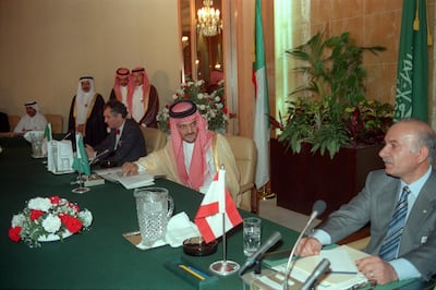 Sitting between Lebanese Parliament speaker Hussain al-Hussaini (R) and Algerian Foreign Minister Ahmad Ghassali (L), Saudi Arabian Foreign Minister Prince Saul al-Faysal (C) looks on 30 September 1989 in Taif after the members of Lebanese National Assembly started to discuss the charter of national reconciliation. The session was attended by 31 Christian and 31 Muslim MP's. At a further meeting 22 October 1989, the charter of national reconciliation (the Taif Agreement) was endorsed by 58 of the 62 deputies attending the session. The Taif agreement provided for the transfer of executive power from the presidency to a cabinet, with portfolios divided equally among Christian and Muslim ministers. (Photo by NABIL ISMAIL / AFP)