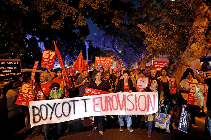 Left wing Israelis hold slogans during a protest against Eurovision in Tel Aviv. While Israel's 2018 Eurovision victory with Netta Barzilai's "Toy" meant the Jewish state would host the next year. 
 AFP