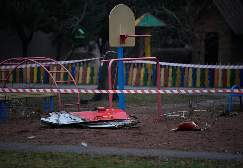 Parts of the helicopter in a playground near the crash site. AP