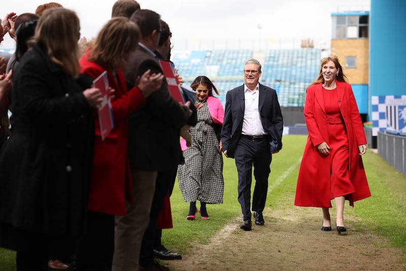 Labour's deputy leader Angela Rayner and Mr Starmer arrive at Gillingham FC. Getty Images