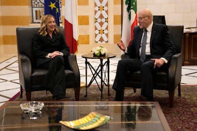 Italian Prime Minister Giorgia Meloni, left, meets with her Lebanese counterpart Najib Mikati, right, upon her arrival at the government palace in Beirut. AP Photo