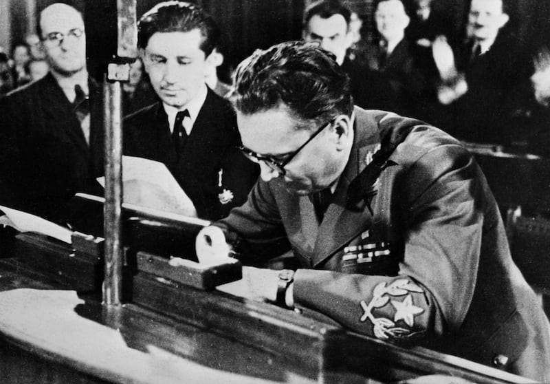 Tito signs the declaration establishing the Federal People's Republic of Yugoslavia in Belgrade on March 7, 1945. AFP