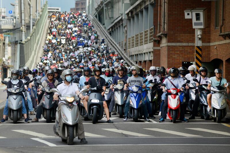 Motorists are seen during the morning rush hour on the Taipei Bridge, Taiwan. Chris Stowers / AFP