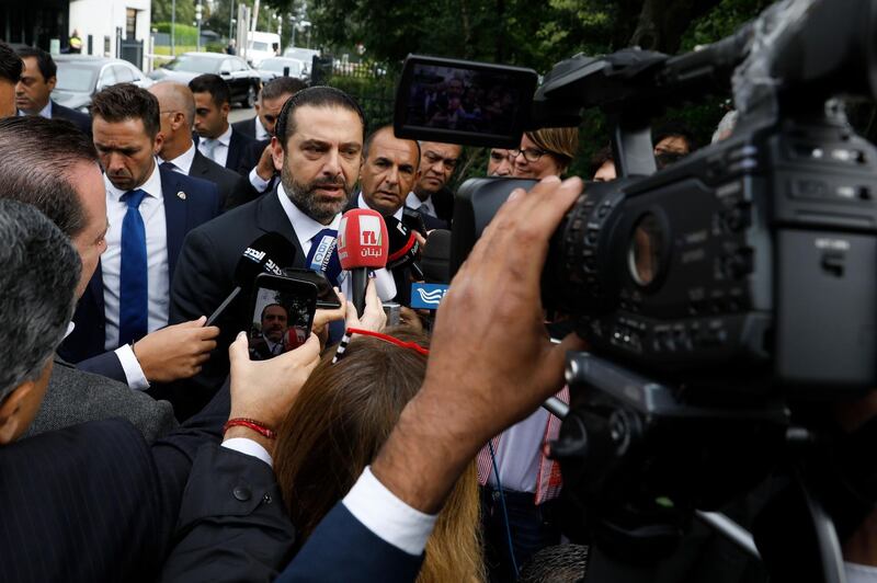 Lebanese premier-designate Saad Hariri speaks to the press in front of the Special Tribunal for Lebanon after the presentation of the closings arguments in the trial of four Hezbollah suspects accused of 2005 assassination of his father the late Lebanese prime minister on September 10, 2018, in The Hague. - The trial of four Hezbollah suspects in the assassination of Lebanese ex-prime minister Rafiq Hariri enters the final stretch on September 11 2018, with closing arguments in the long-running case. The Special Tribunal for Lebanon is unique in international law as it can try suspects in absentia, as well as for its ability to try accused perpetrators of an individual terrorist attack. (Photo by Bas CZERWINSKI / ANP / AFP) / Netherlands OUT