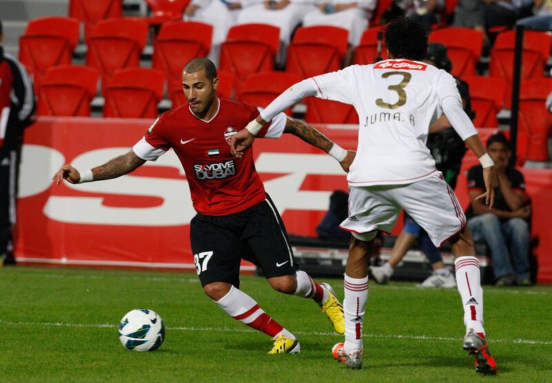 Abu Dhabi, United Arab Emirates , Jan 26 2013, Al Jazira v Al Ahli- (left) Al Ahli's #37Ricardo Quaresma works the ball free and shoots on goal . Mike Young / The NationaL