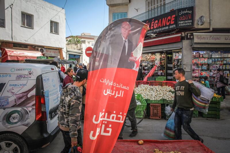 A banner featuring Kais Saied, Tunisia's president, outside a food store in the Ariana district of Tunis.