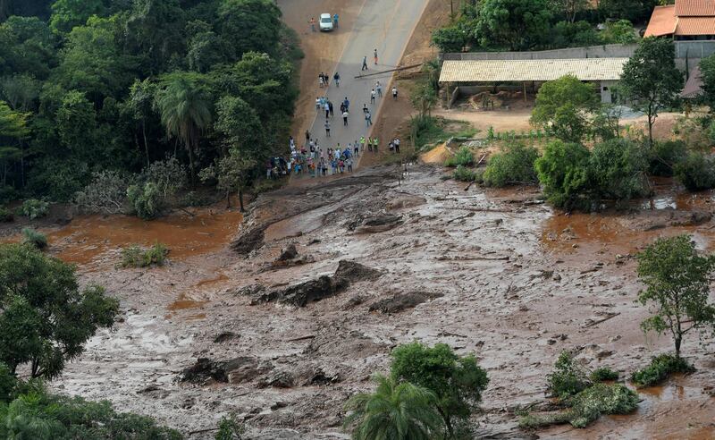 Residents look at the destruction caused by a dam burst in Brazil. Reuters