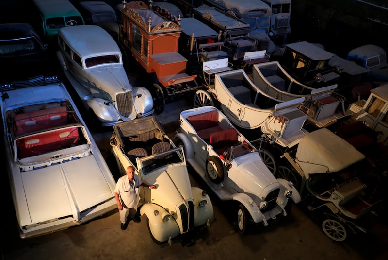 Sayed Sima, a 70-years-old Egyptian collector of vintage cars, stands next to a British Standard Flying Eight Tourer - 1948 automobile in his store where he also has his own exhibition of old cars, in the Giza suburb of Abu Rawash, Egypt October 25, 2020. Picture taken October 25, 2020. REUTERS/Amr Abdallah Dalsh     TPX IMAGES OF THE DAY