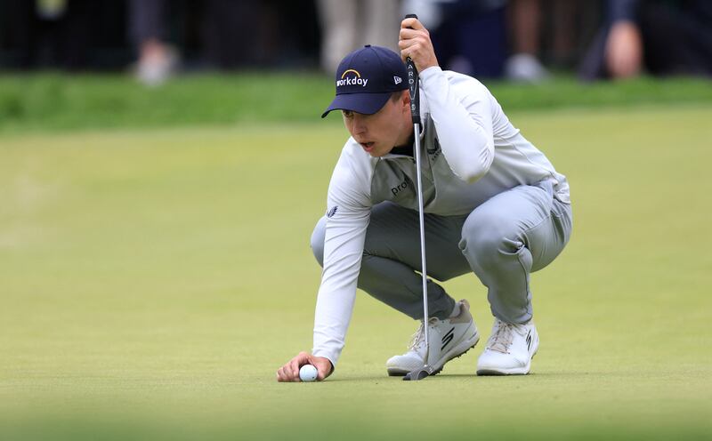 Matt Fitzpatrick lines up a putt on the 18th green during the final round of the US Open. Reuters