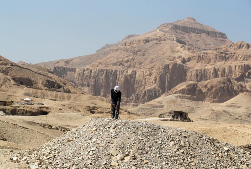 A worker is digging at the site where nearly 30 painted coffins were discovered, at Al-Asasif Necropolis in the Vally of Kings in Luxor, Egypt. Reuters