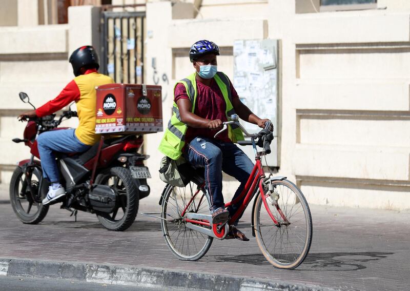 Dubai, United Arab Emirates - Reporter: N/A. News. Coronavirus/Covid-19. A man on a bike wears a mask to curb the spread of the coronavirus in Satwa, Dubai. Tuesday, October 20th, 2020. Dubai. Chris Whiteoak / The National