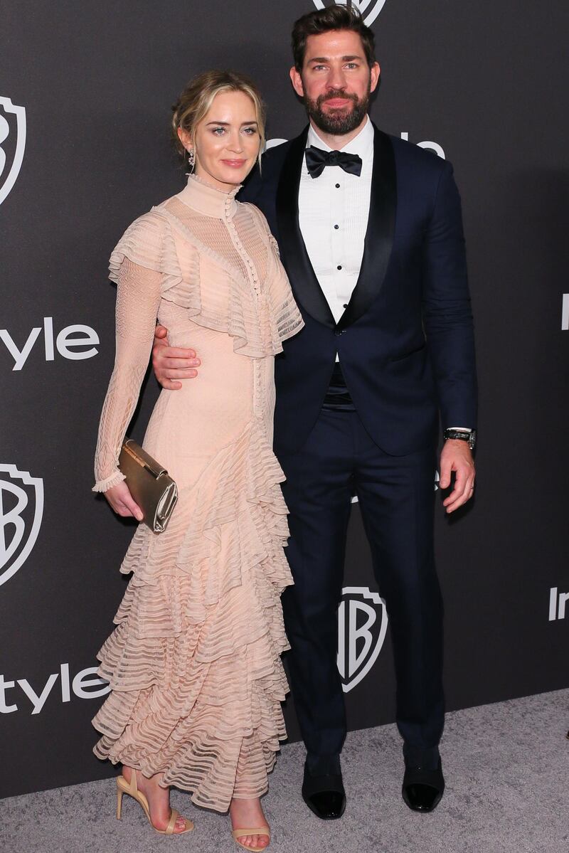 Emily Blunt wears a classic blush-coloured Alexander McQueen dress paired with a Jimmy Choo clutch and Alexander Birman shoes, while hubby John Krasinski dons Brunello Cucinelli tux and Christian Louboutin shoes. AFP / Jean-Baptiste LACROIX