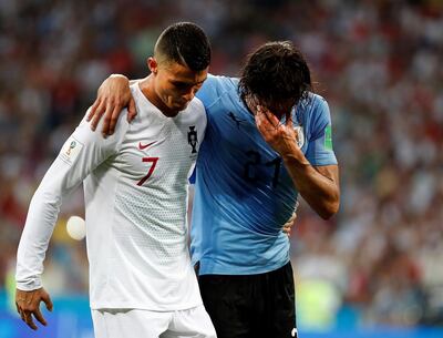 epaselect epa06853381 Portugal's Cristiano Ronaldo (L) helps Uruguay's Edinson Cavani during the FIFA World Cup 2018 round of 16 soccer match between Uruguay and Portugal in Sochi, Russia, 30 June 2018.

(RESTRICTIONS APPLY: Editorial Use Only, not used in association with any commercial entity - Images must not be used in any form of alert service or push service of any kind including via mobile alert services, downloads to mobile devices or MMS messaging - Images must appear as still images and must not emulate match action video footage - No alteration is made to, and no text or image is superimposed over, any published image which: (a) intentionally obscures or removes a sponsor identification image; or (b) adds or overlays the commercial identification of any third party which is not officially associated with the FIFA World Cup)  EPA/JUAN HERRERO EDITORIAL USE ONLY  EDITORIAL USE ONLY