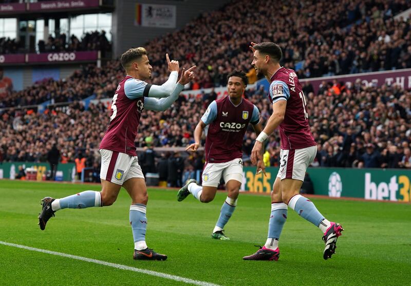 Philippe Coutinho (l) celebrates scoring. PA