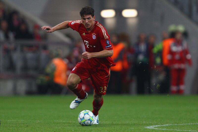 MUNICH, GERMANY - APRIL 03:  Mario Gomez of FC Bayern Muenchen runs with the ball during the UEFA Champions League quarter final second leg match between FC Bayern Muenchen and Olympic de Marseille at Allianz Arena on April 3, 2012 in Munich, Germany.  (Photo by Alexander Hassenstein/Bongarts/Getty Images) 