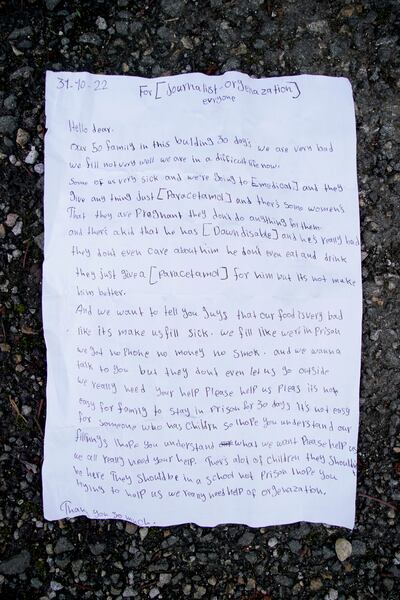 A letter thrown by a young girl over the fence at the Manston immigration facility. PA