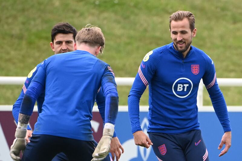 England's defender Harry Maguire (L), England's goalkeeper Jordan Pickford (C) and England's forward Harry Kane (R) attend an England training session at St George's Park in Burton-on-Trent, central England, on July 5, 2021.  - England take on Denmark at Wembley on July 7, 2021 in the semi-finals of the UEFA EURO 2020.  (Photo by Paul ELLIS  /  AFP)