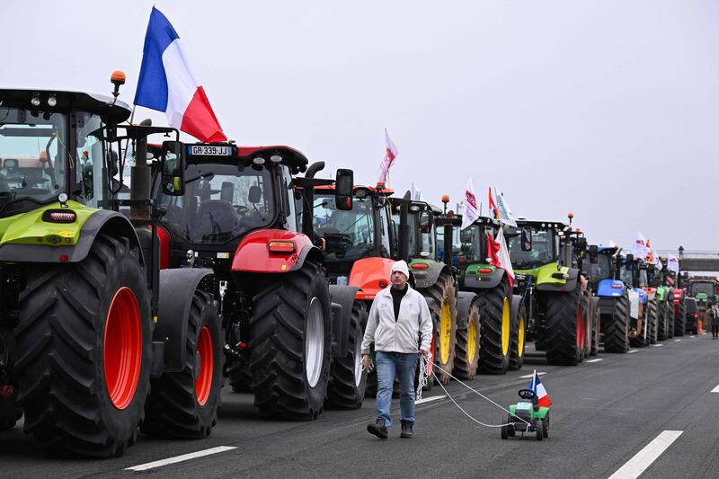 French farmers block a motorway east of Paris amid nationwide protests over pay, tax and regulations. AFP