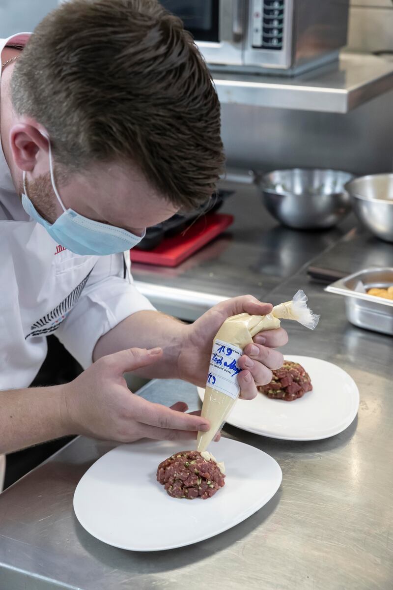 The chef supplies the finishing touches to another mouth-watering dish