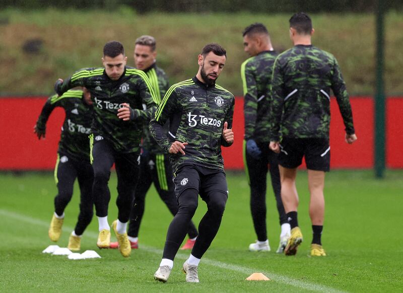 Manchester United's Bruno Fernandes with teammates during training. Reuters