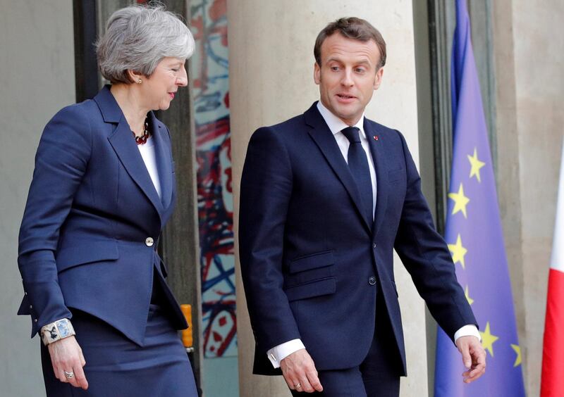 French President Emmanuel Macron and British Prime Minister Theresa May leave after a meeting to discuss Brexit, at the Elysee Palace in Paris, France, April 9, 2019. REUTERS/Philippe Wojazer
