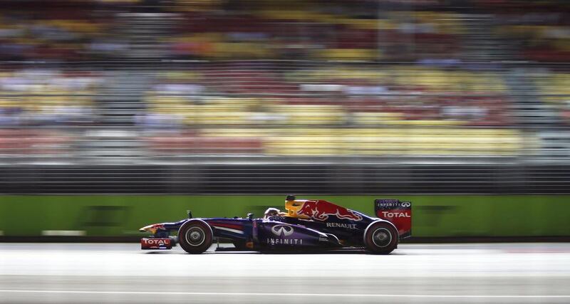 Sebastian Vettel was fastest in practice in Singapore in his Red Bull Racing car.