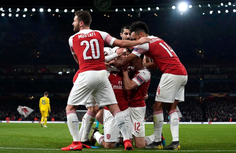 epa07386231 Arsenal's Sokratis (C) celebrates with teammates after scoring during the UEFA Europe League soccer match between Arsenal and FC BATE Borisov at Emirates Stadium, London, Britain, 21 February 2019.  EPA/WILL OLIVER