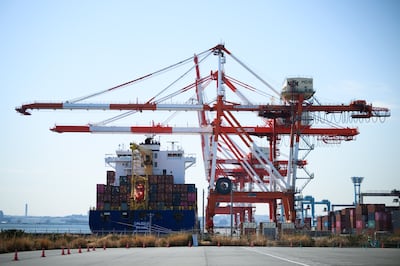 A container ship approaches a shipping terminal in Yokohama, Japan. Akio Kon / Bloomberg