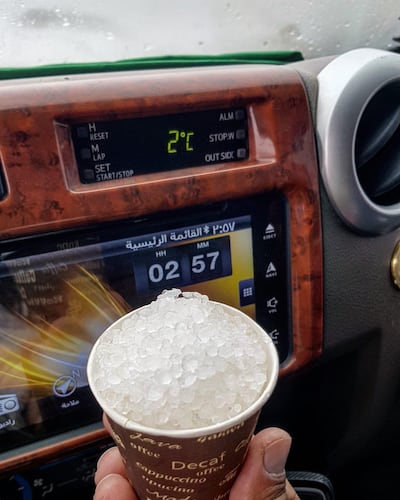 Rashed Al Shehhi collected hail stones that fell in the Jebel Jais area on Sunday. The thermometre on his car dashboard reads 2C - much colder than the coastal cities of Dubai and Abu Dhabi. Courtesy: Rashed Al Shehhi