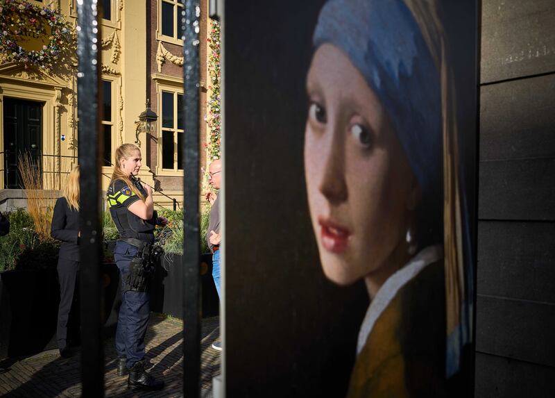 A police officer stands outside the Mauritshuis museum, where three people were arrested for attempting to smudge Vermeer's painting 'Girl with a Pearl Earring', currently exhibited there, in The Hague, Netherlands on October 27, 2022. EPA