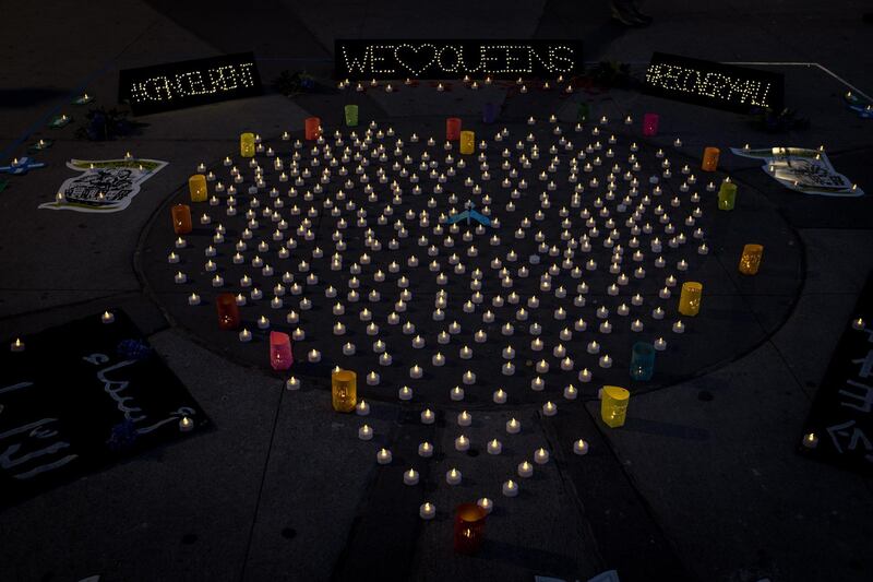 Candles arranged in the shape of a heart are set as a vigil honoring coronavirus victims in Queens, New York.  EPA