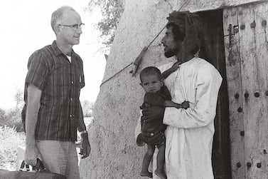 This handout photograph is an archival image of the Oasis hospital in the 1960s. The image shows: Dr. Pat Kennedy making a house call to a local village, 1960