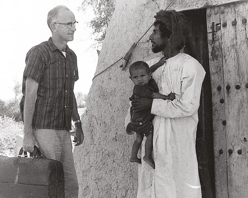 This handout photograph is an archival image of the Oasis hospital in the 1960s. The image shows: Dr. Pat Kennedy making a house call to a local village, 1960